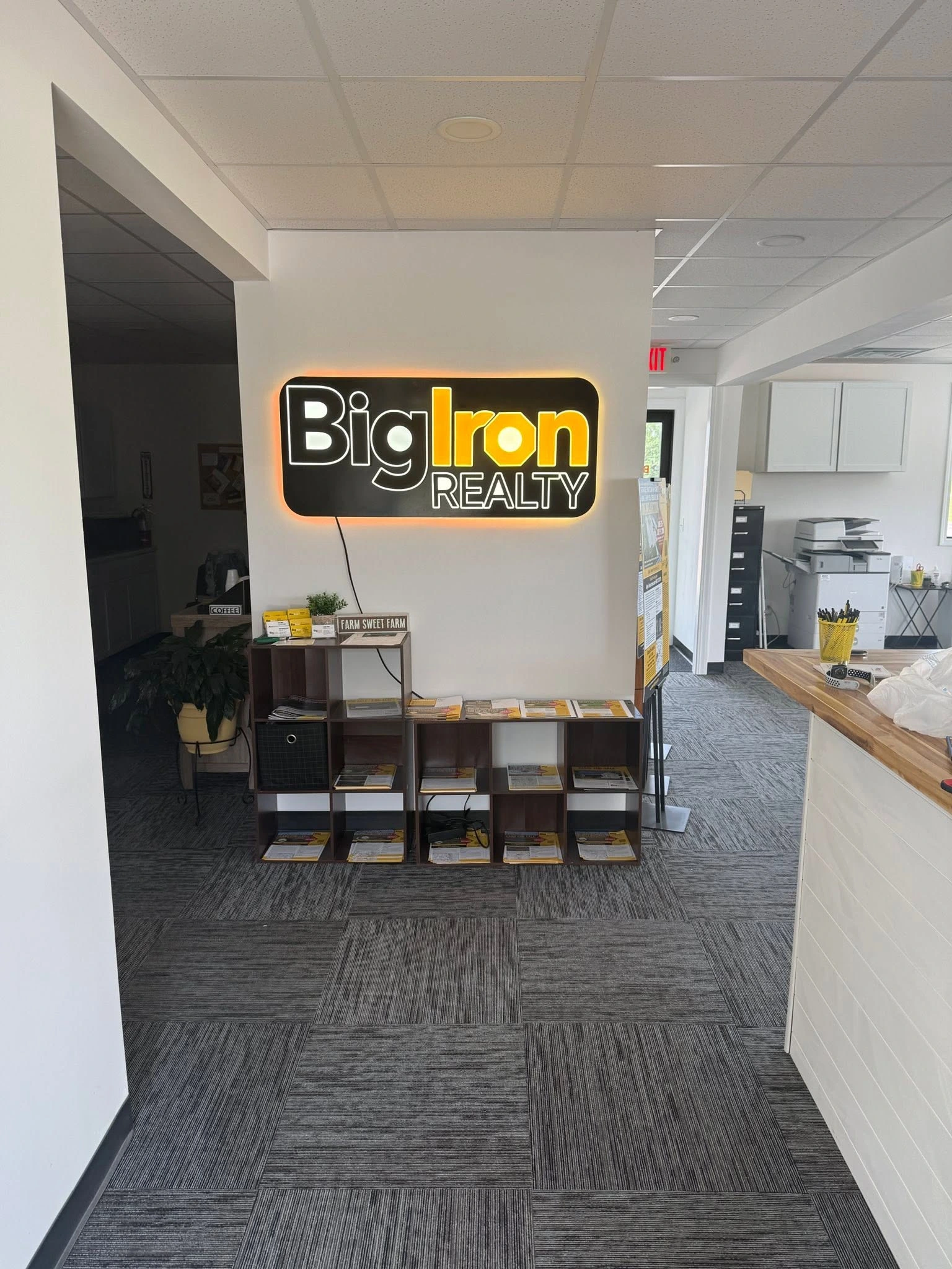 Big Iron Realty sign shown in the full office interior